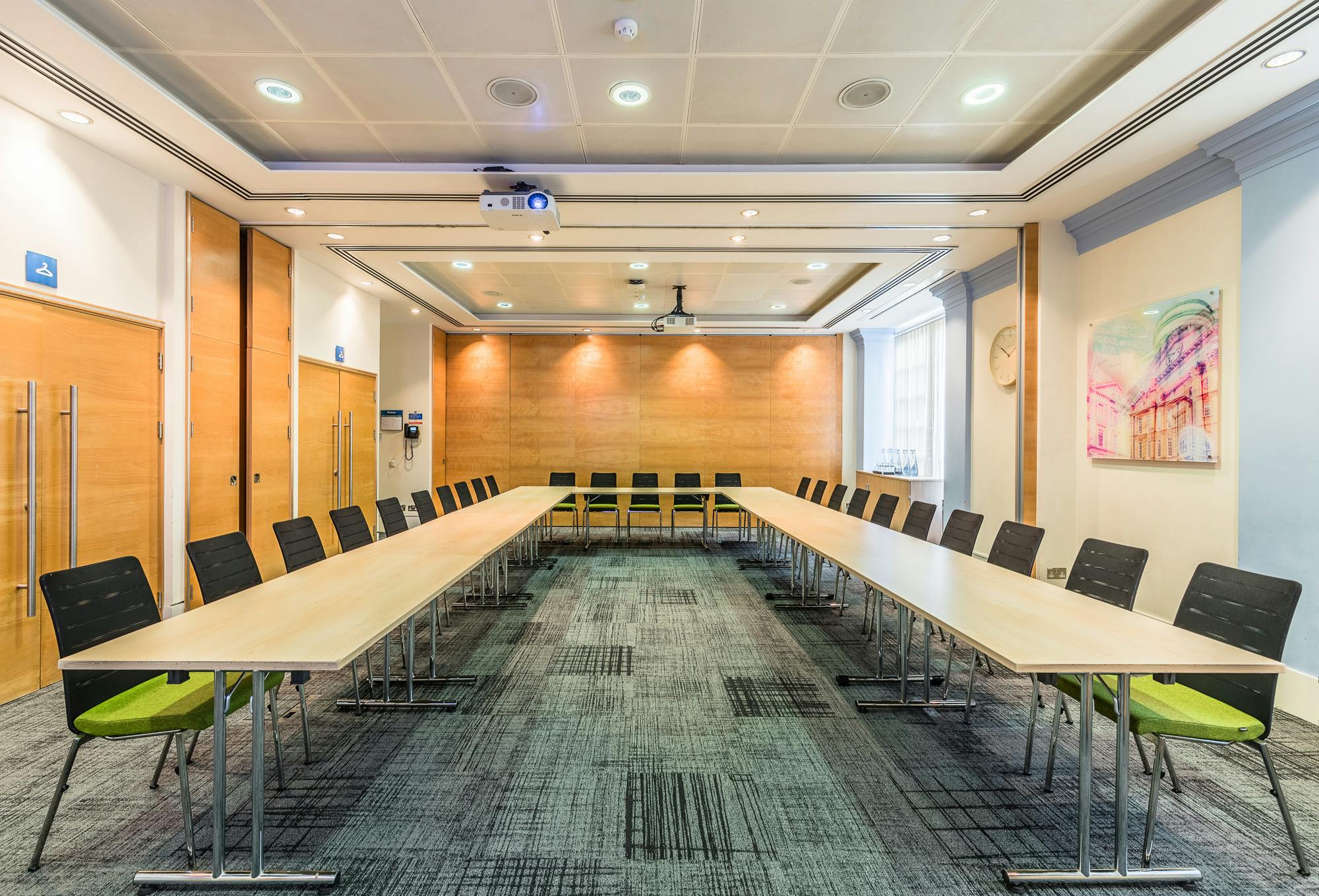 Anderson Barnes Suite meeting room with U-shaped table, ideal for conferences and presentations.