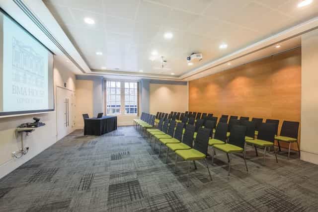 Murrell Barnes Suite: modern meeting room with projector, ideal for events and workshops.