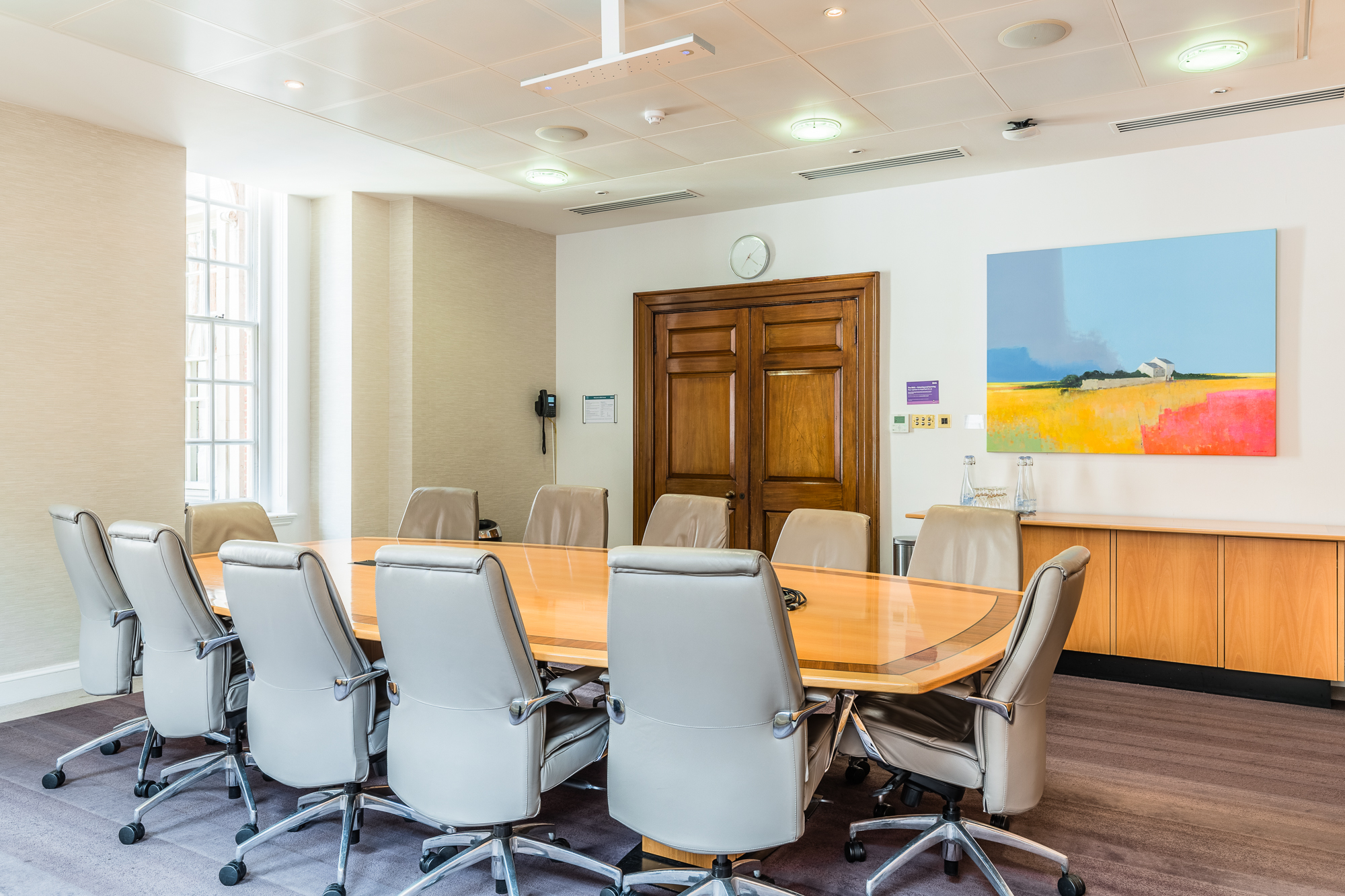 Carter Room at BMA House: modern conference space with polished table for meetings.