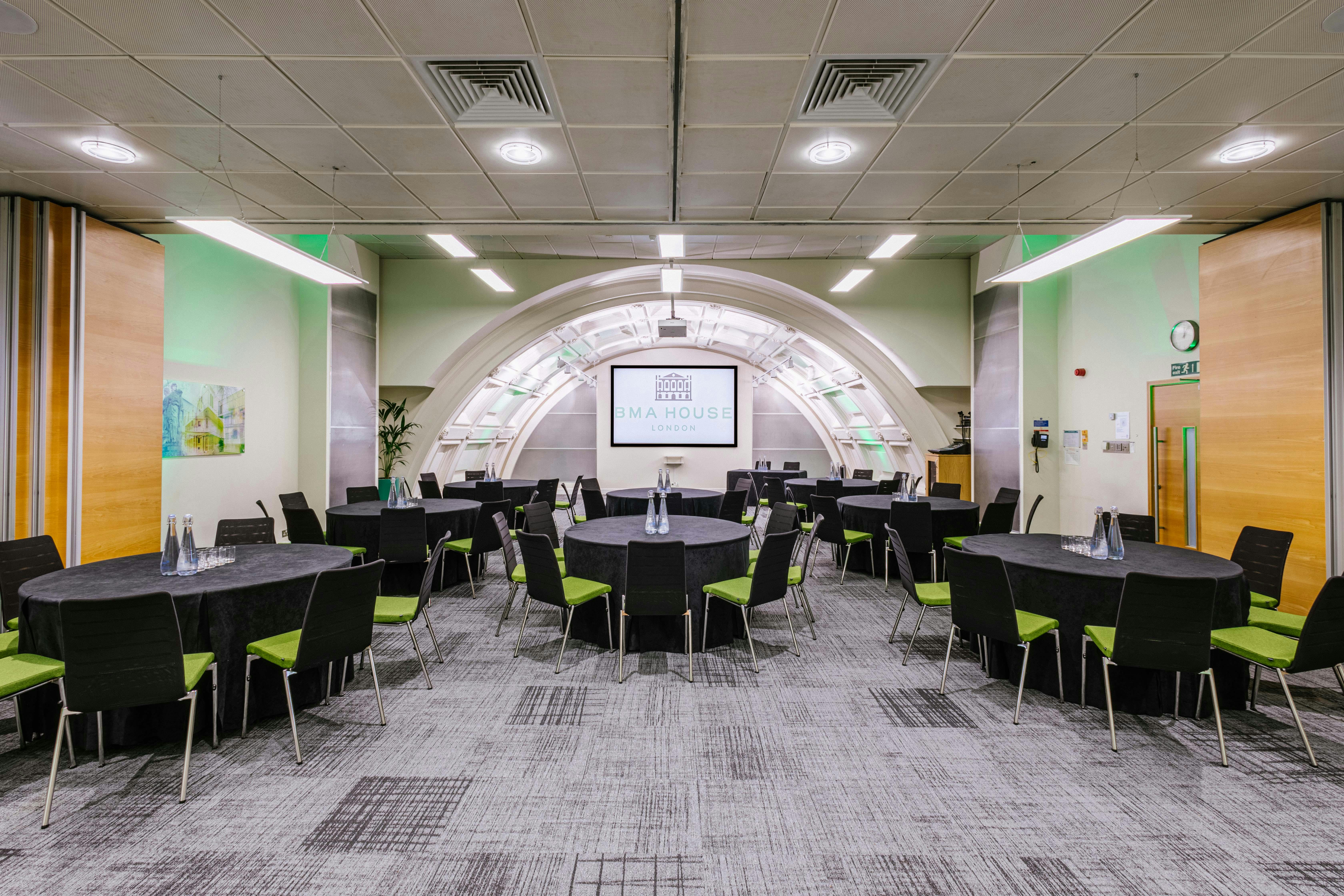 Bevan Suite at BMA House: modern meeting space with round tables for events and presentations.