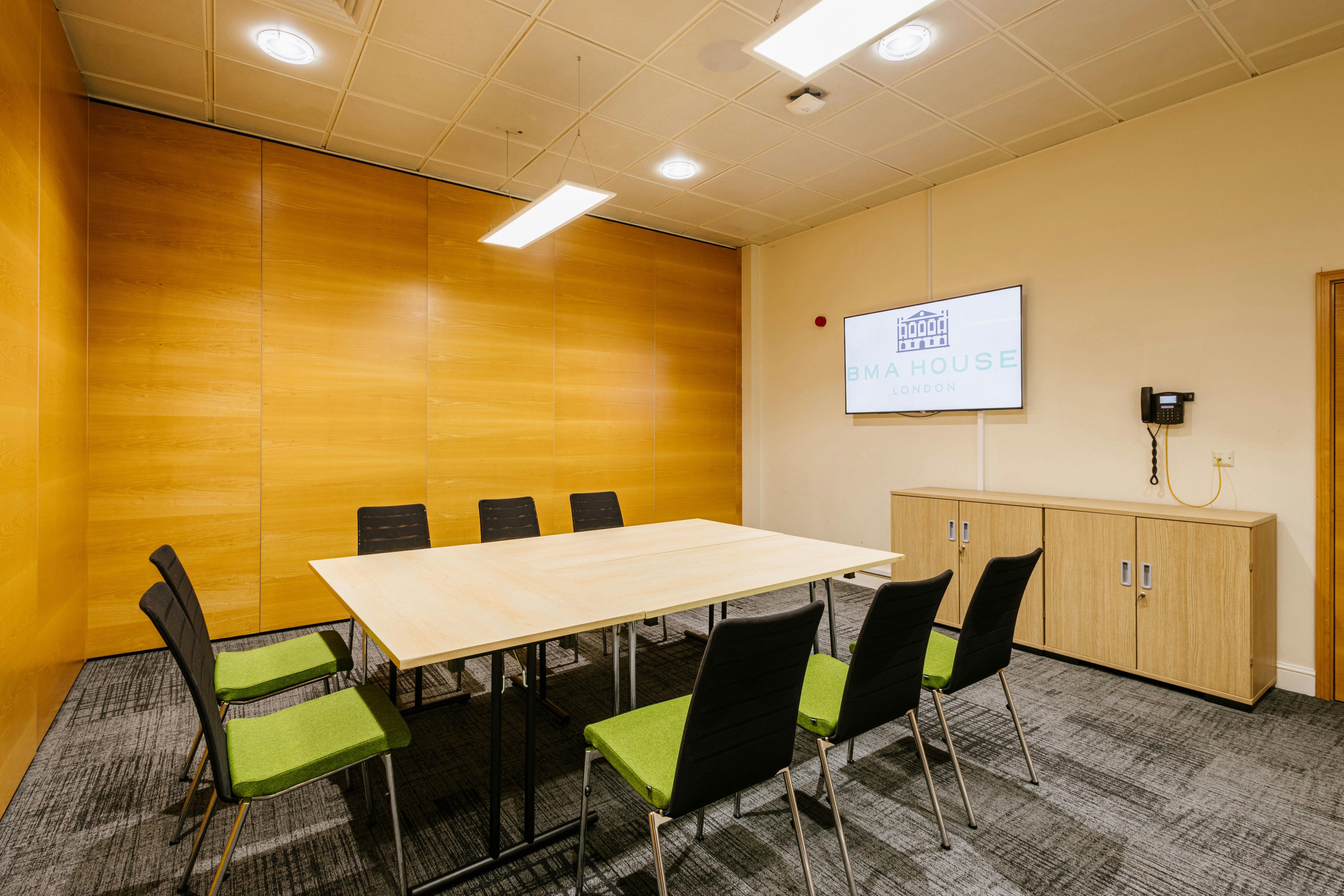 Modern meeting room in BMA House with ergonomic chairs, ideal for presentations and collaboration.