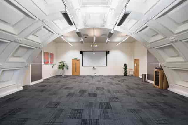 Spacious Harvey room in BMA House, ideal for meetings and workshops with arched ceiling.