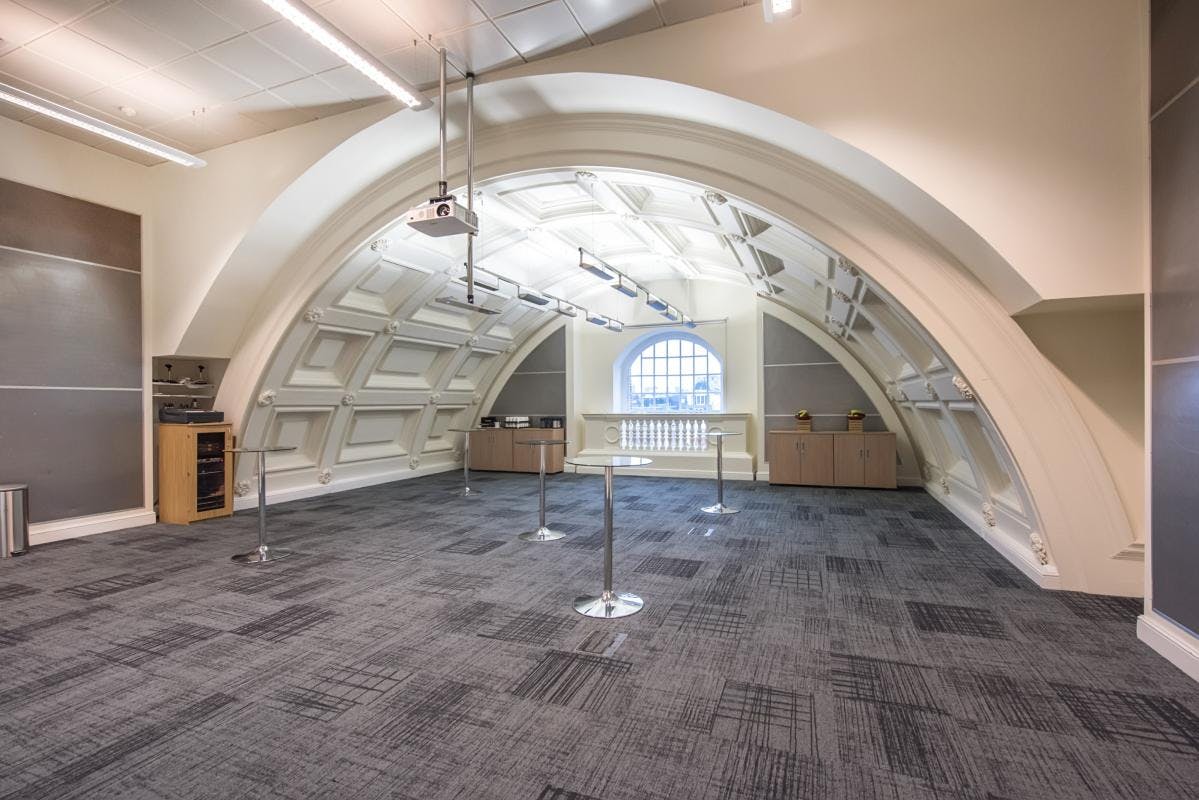 Spacious Harvey room in BMA House with arched ceiling for meetings and conferences.