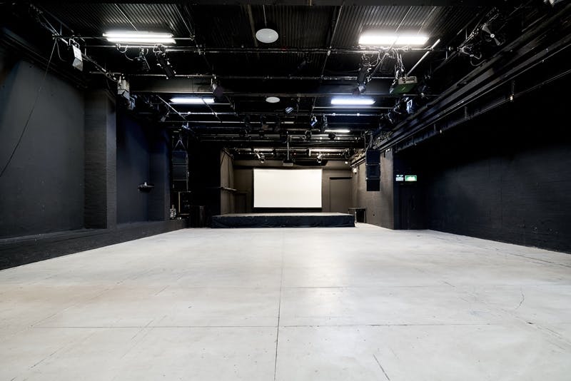 Versatile ICA Theatre with minimalist design, ideal for conferences and workshops.