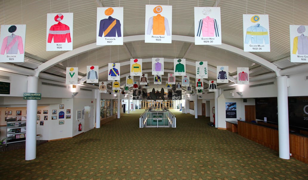 Hall of Fame at Cheltenham Racecourse with colorful jockey silks, ideal for racing events.