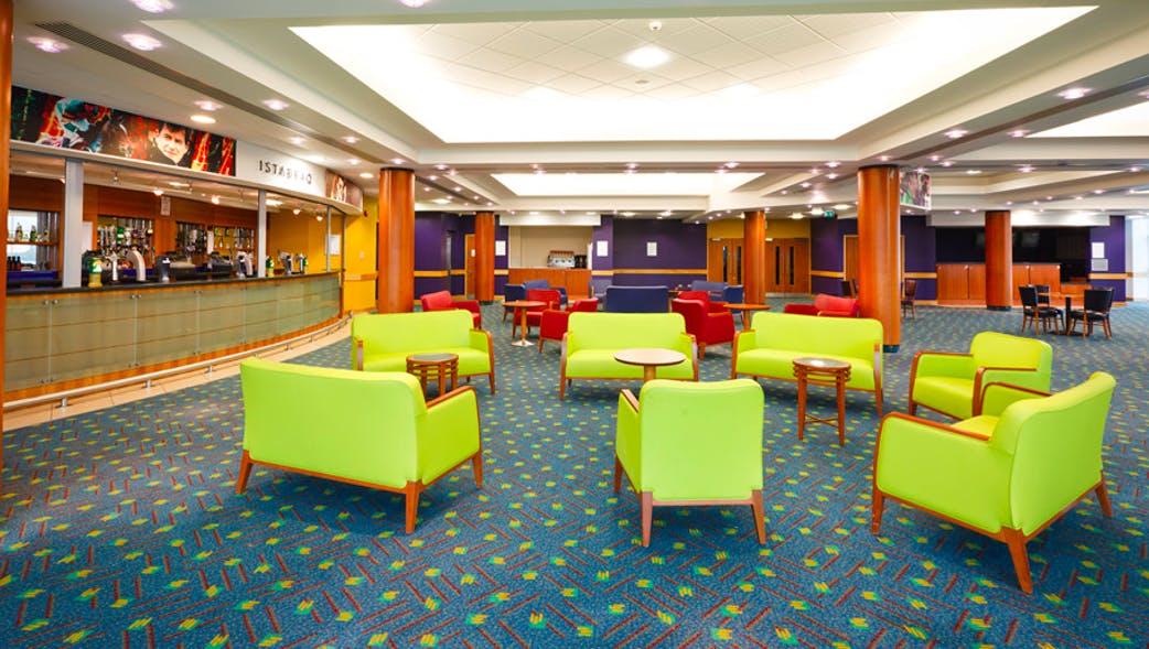 Vibrant lounge at Cheltenham Racecourse for networking and social events.