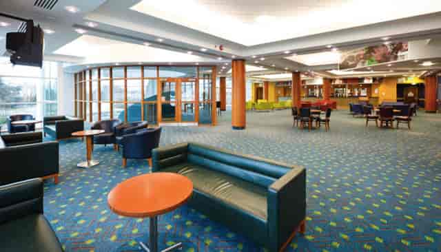 Modern Cheltenham Racecourse venue with vibrant colors for networking events.