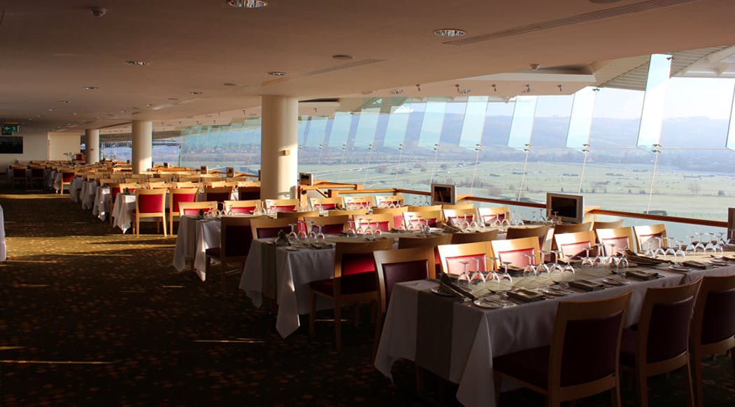 Elegant dining area at Cheltenham Racecourse, ideal for corporate events and gatherings.