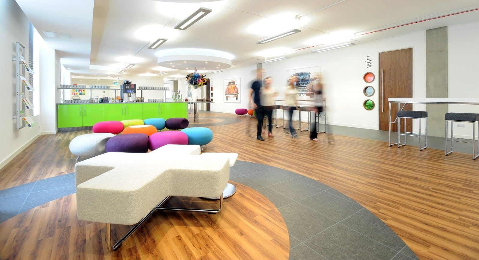 Modern event space in Manchester with colorful seating for networking and collaboration.