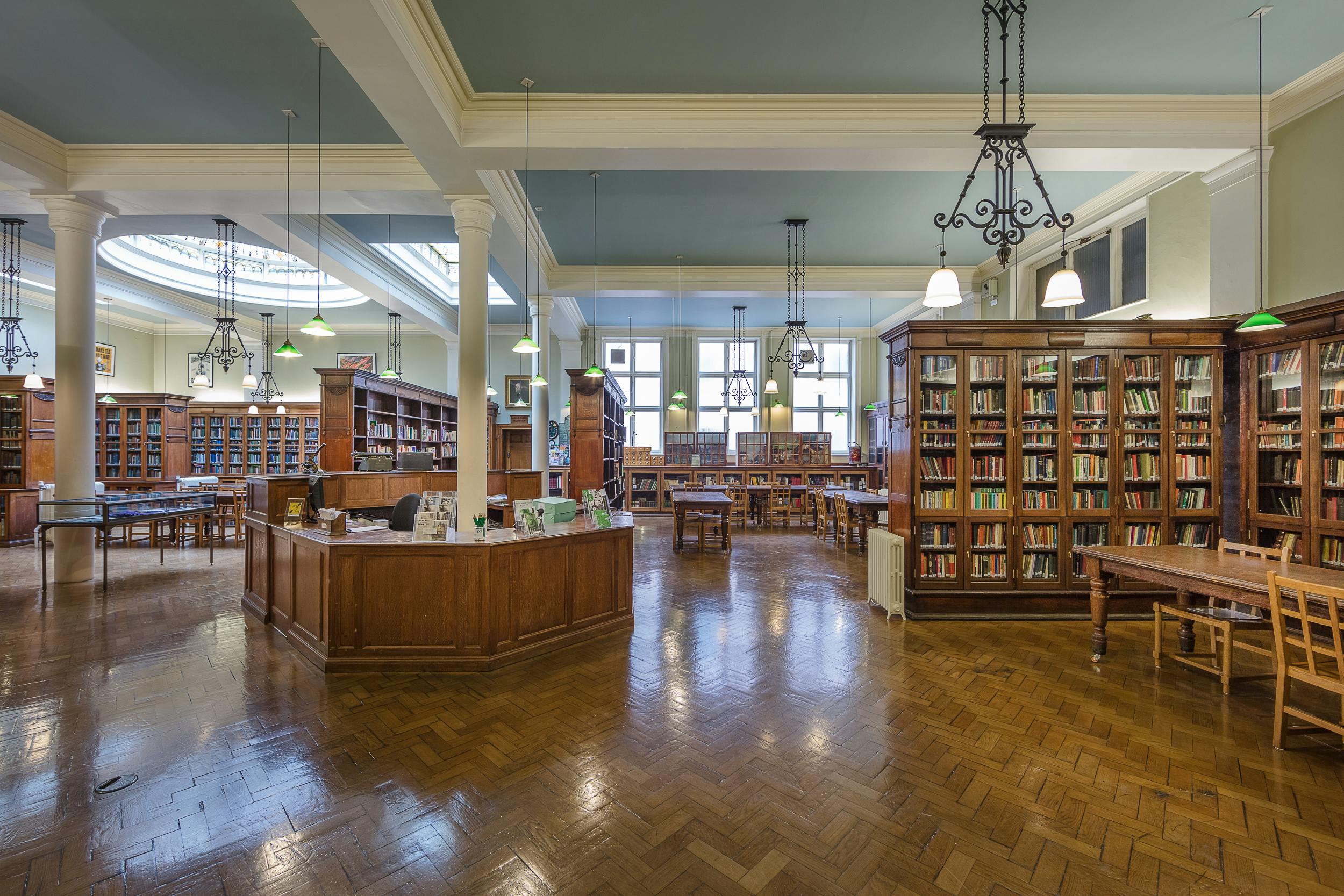 Victorian Library at Bishopsgate Institute with elegant wooden shelves, ideal for events.