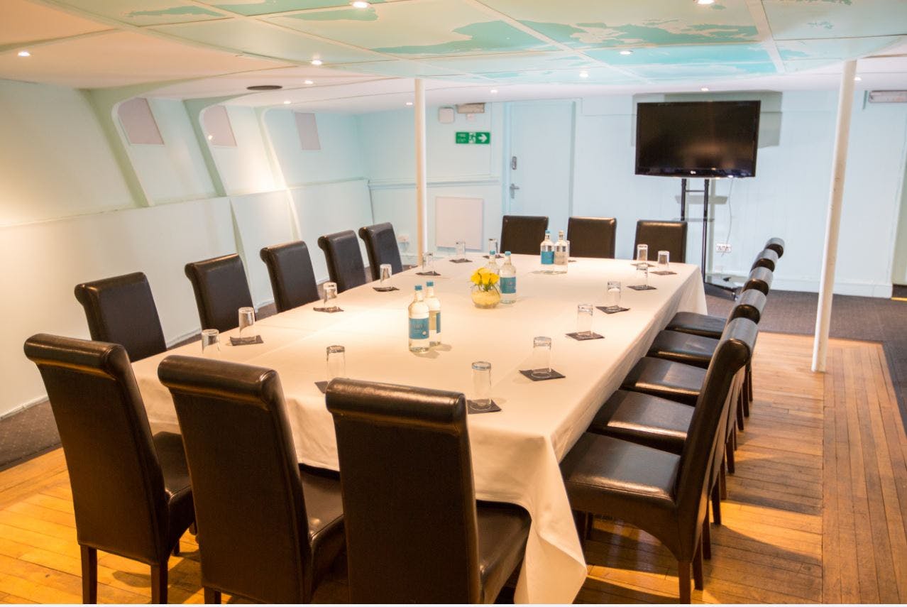 Officers' Mess in R.S. Hispaniola, meeting room with long table for professional gatherings.