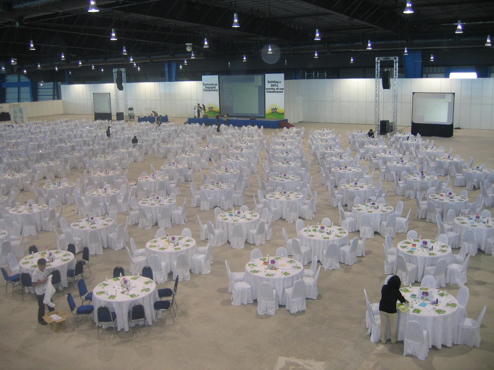 Changi Exhibition Centre banquet setup with round tables for conferences and events.