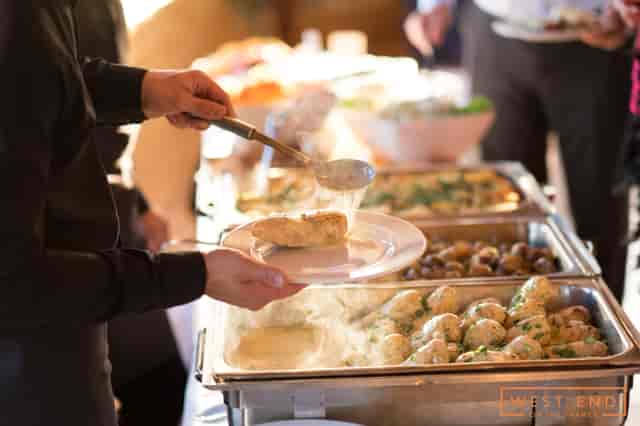 Buffet setup at The Vessel, West End: fresh dishes for successful catering events.
