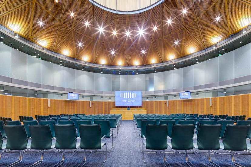 Modern conference hall at Wembley with tiered seating, ideal for corporate events.