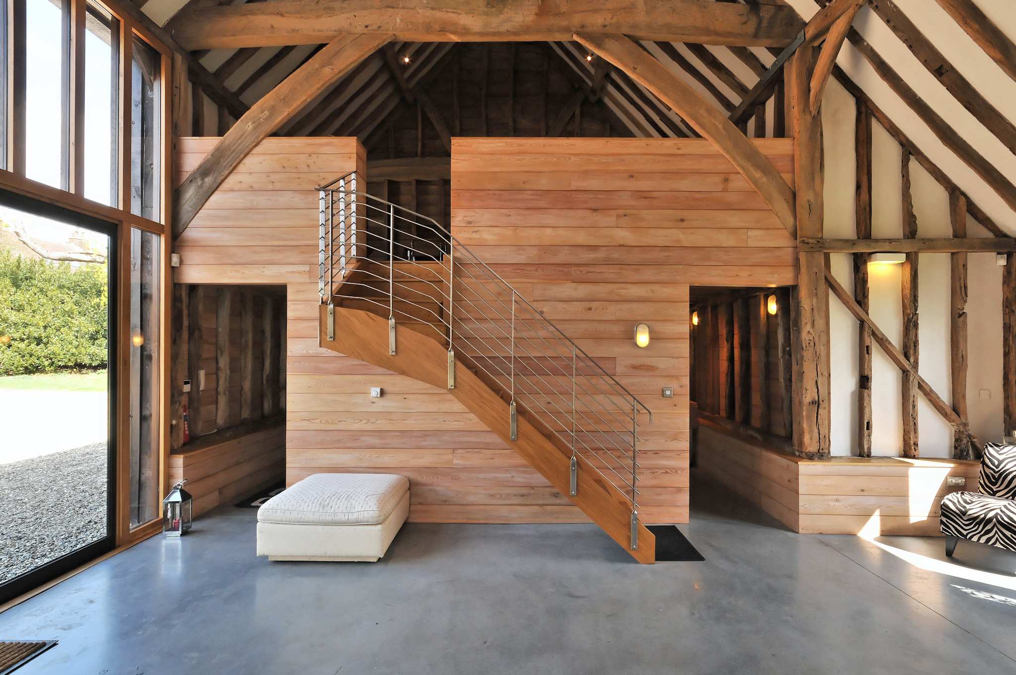Modern rustic barn venue with high ceilings, ideal for events and gatherings. - Banner