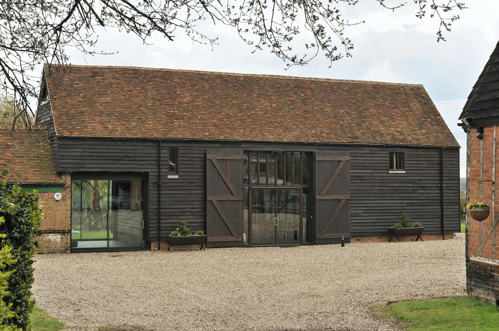 Charming Rowley Barn venue with rustic exterior, ideal for corporate retreats and events.