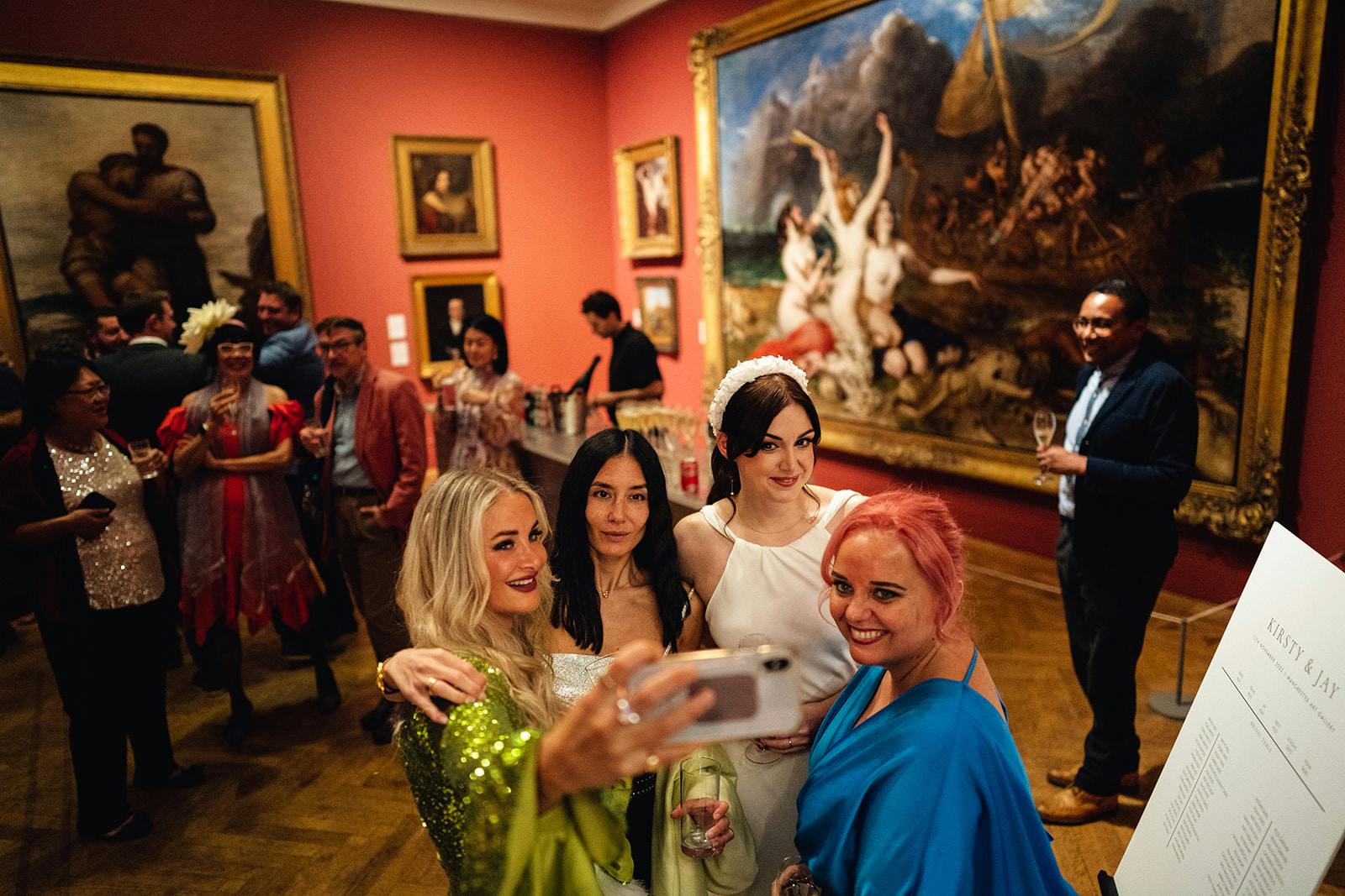 Victorian Galleries event in Manchester Art Gallery with guests enjoying vibrant atmosphere.