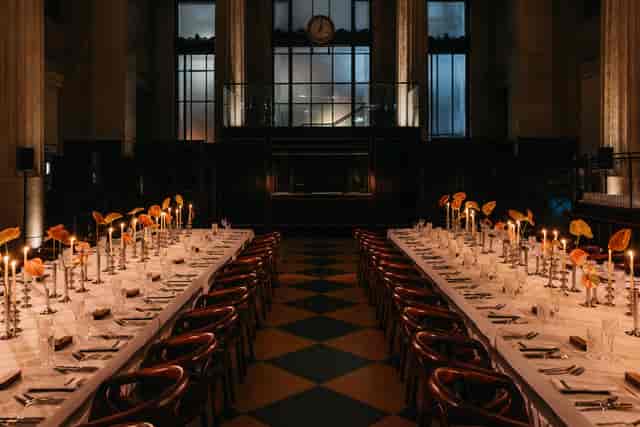 Elegant banquet setup in Banking Hall with candlelight for premium gala or corporate dinner.