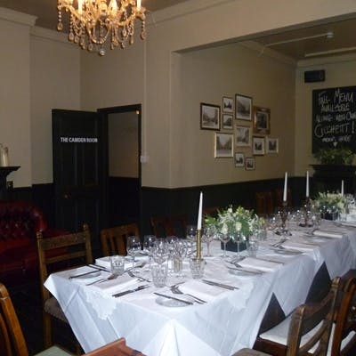 Elegant dining space in The Vine's front garden, ideal for corporate dinners and gatherings.