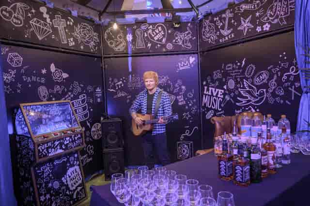Life-sized musician figure at Madame Tussauds' vibrant event space for entertainment events.