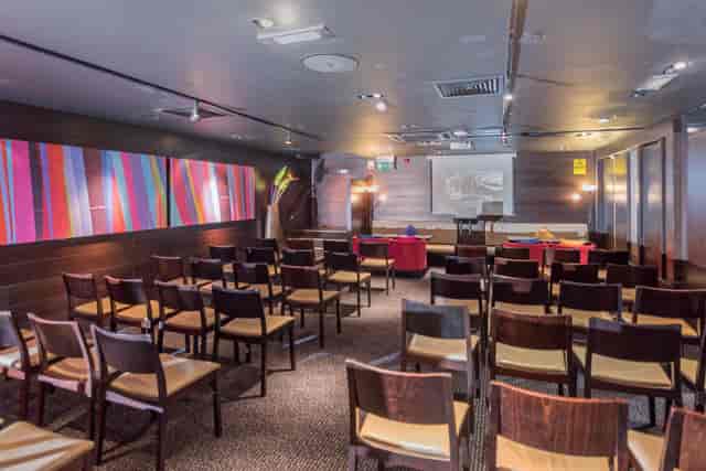 Theater-style setup in Jaipur Room, Mint Leaf; ideal for corporate meetings and presentations.