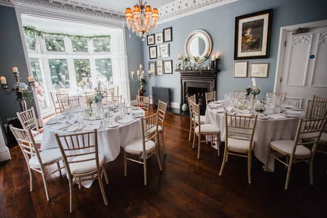 Elegant dining area in Blue Lounge, Didsbury House Hotel for weddings and events.