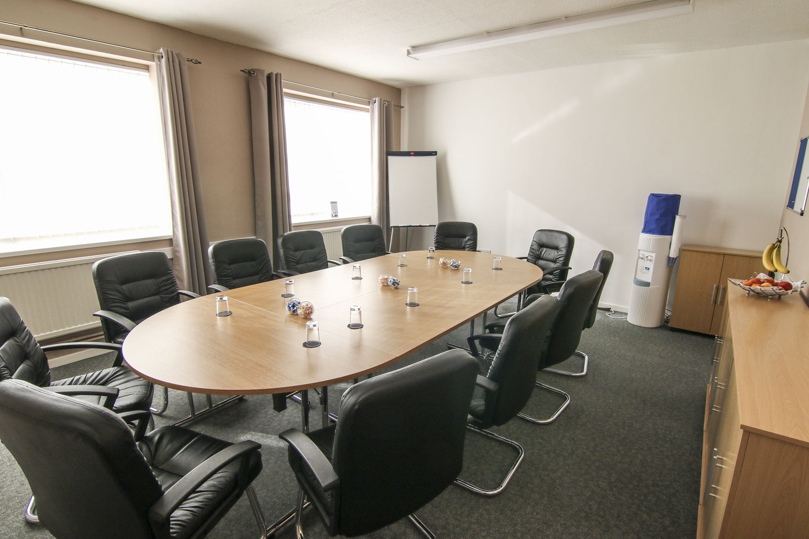 Meeting room in Ayton House with oval table, ideal for professional events and gatherings. - Banner
