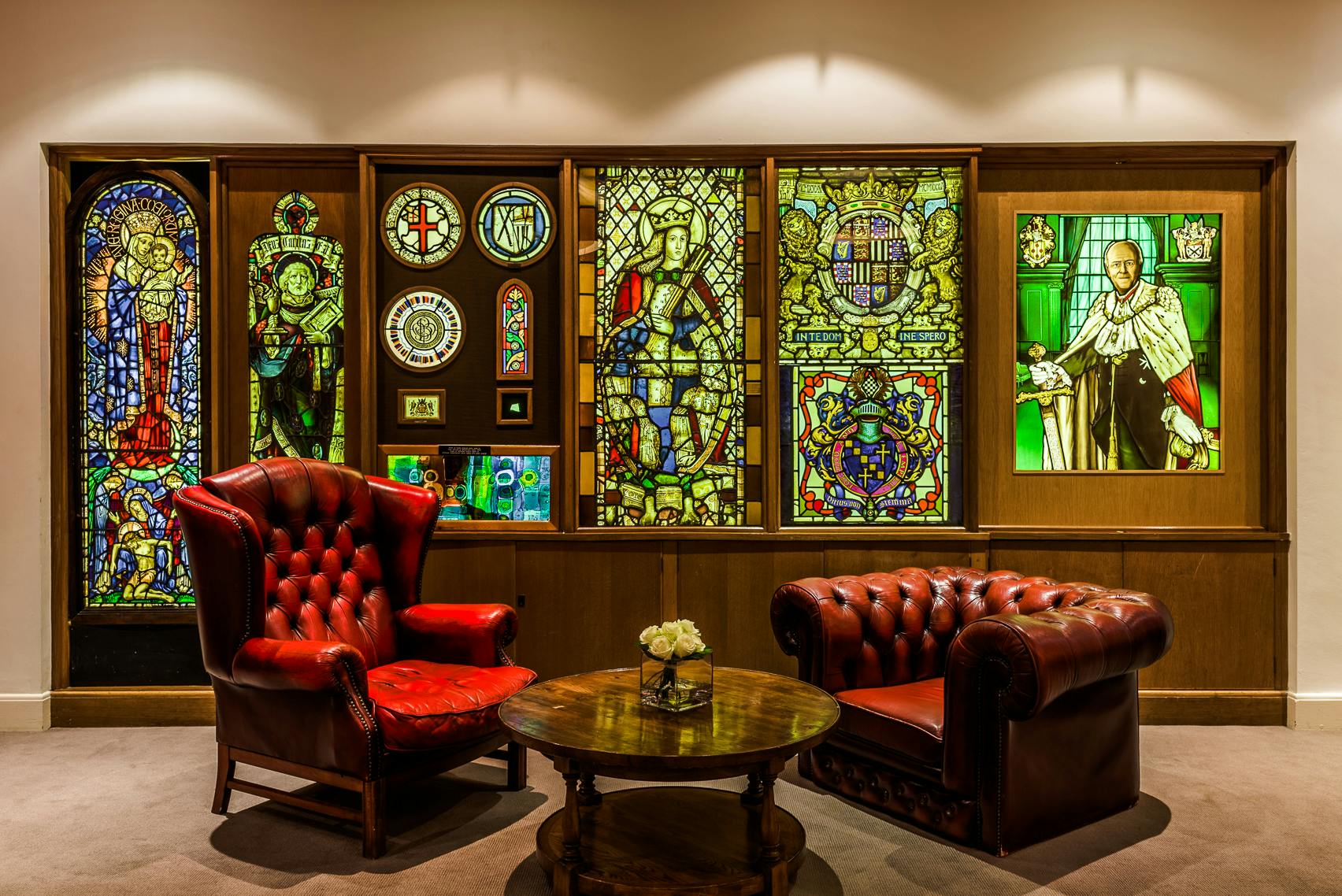 Elegant meeting space with stained glass windows at Glaziers Hall for networking events.