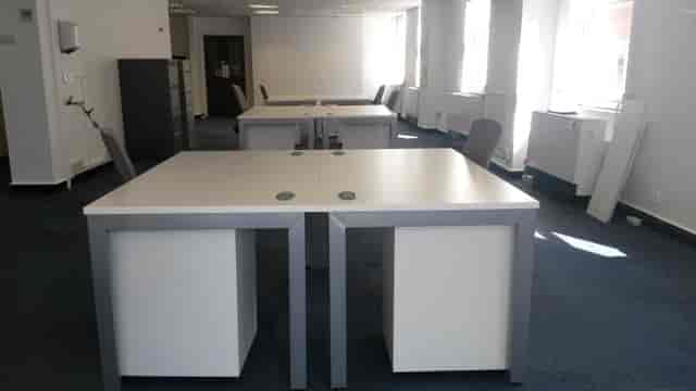 Empty coworking space for professional workshops and corporate meetings.