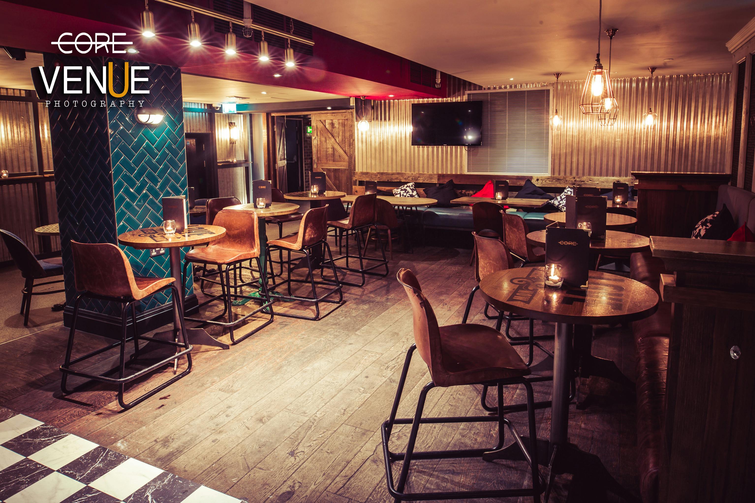Stylish lounge in Core Bar with cozy seating for events and gatherings.