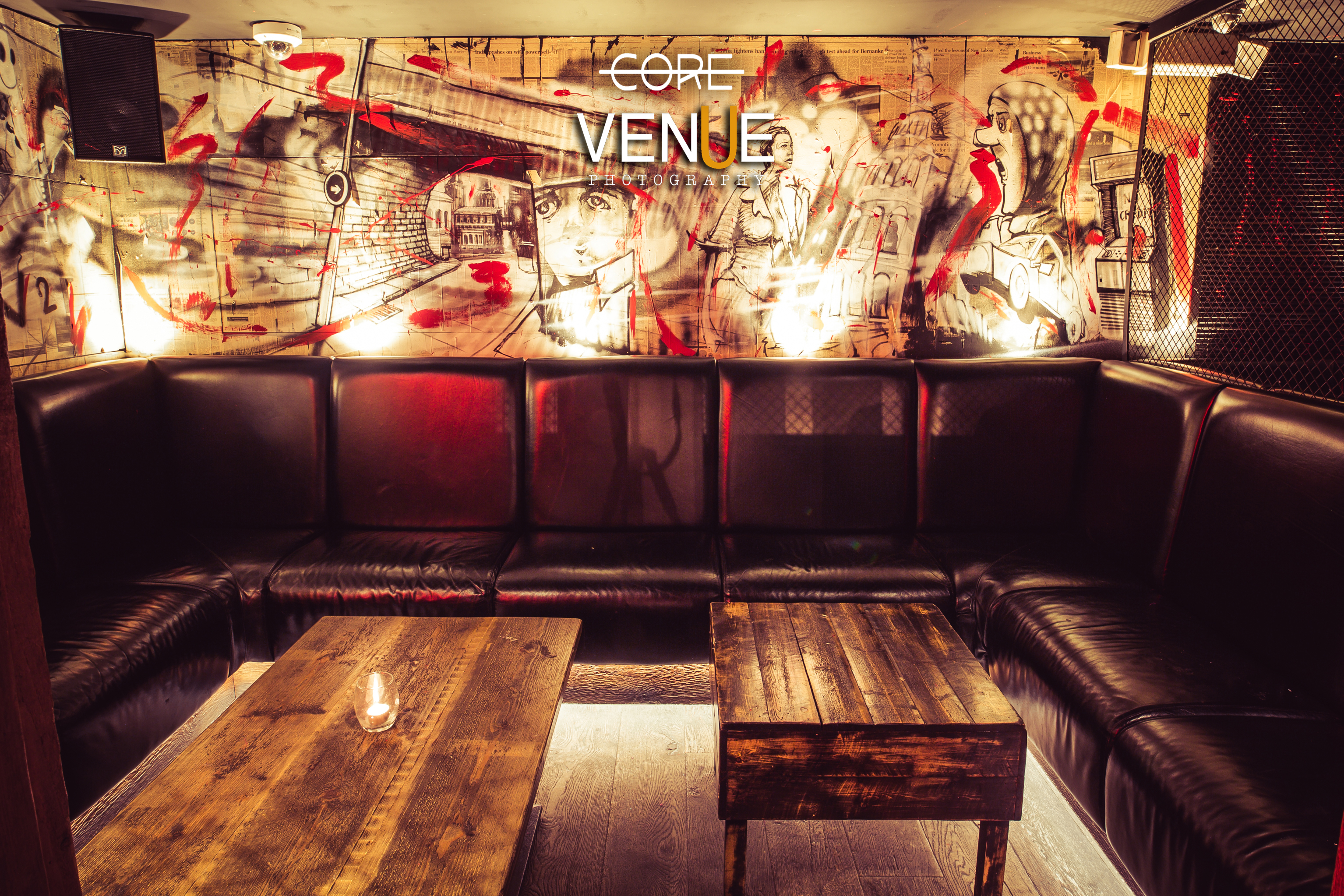 Stylish lounge with leather seating, ideal for networking events and gatherings. - Banner