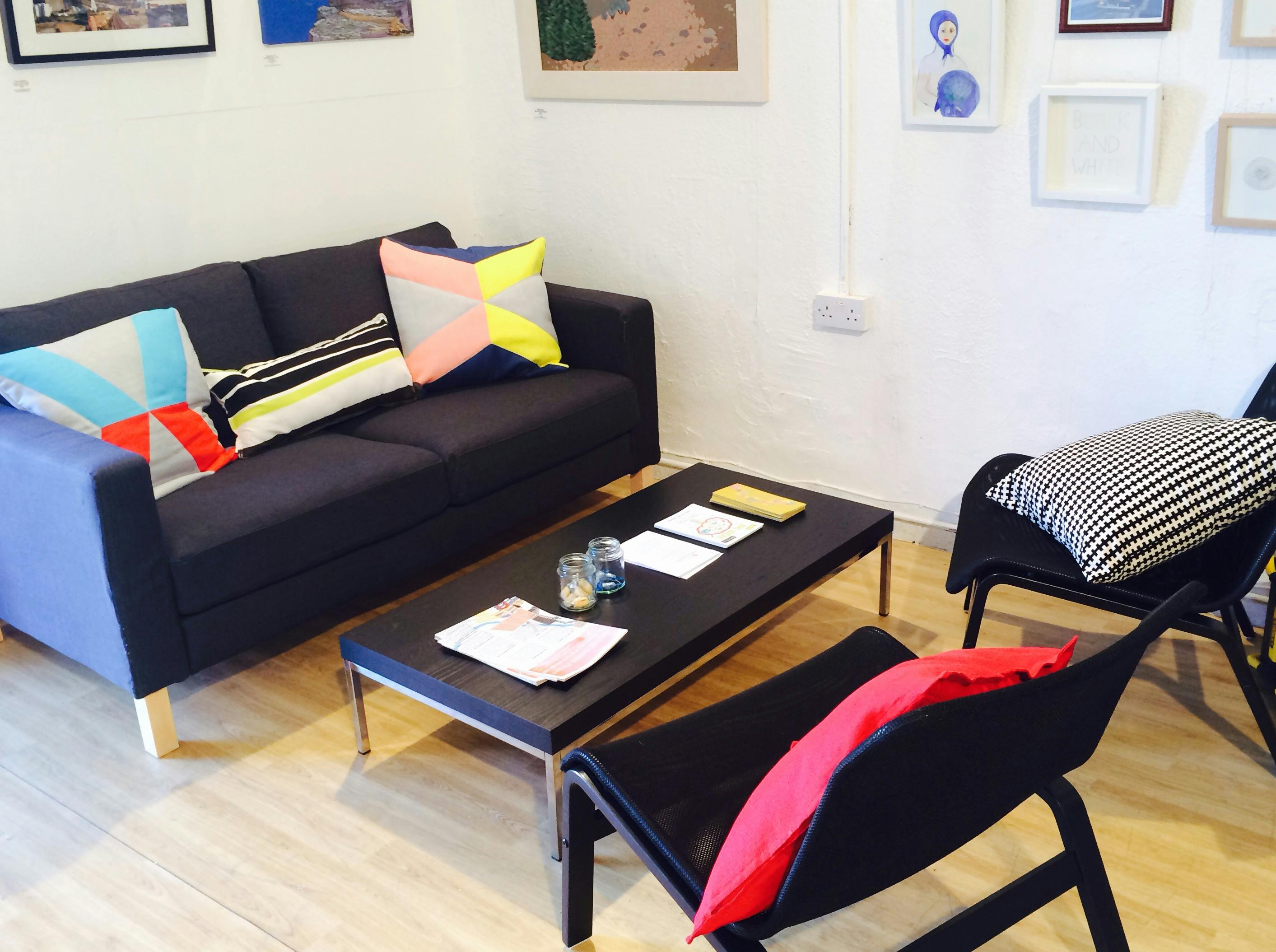 Cozy meeting space at BAR Gallery with modern furniture for creative brainstorming sessions.