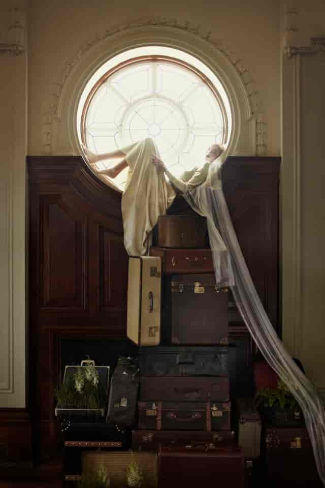 De Montfort Suite with vintage suitcases for creative event design and storytelling.