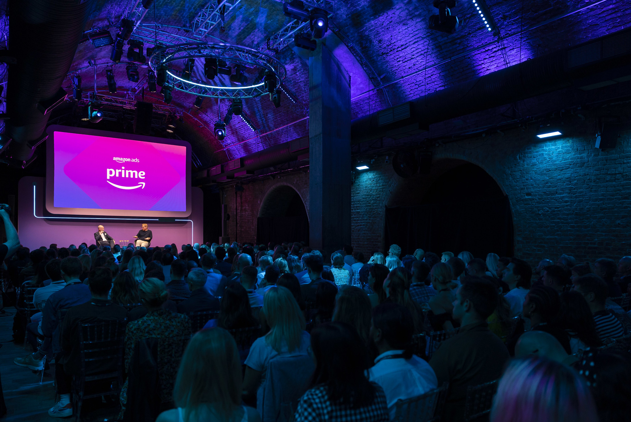 Whole Venue at The Steel Yard with vibrant lighting, ideal for networking events. - Banner