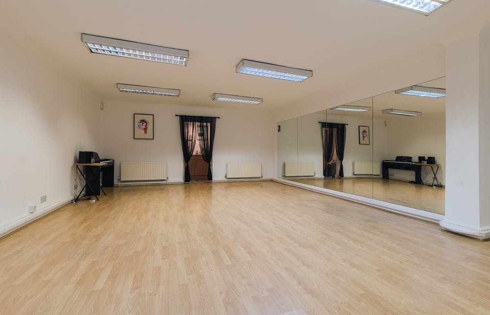 Versatile event space with natural light, ideal for workshops and fitness classes.