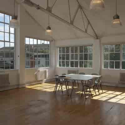 Modern breakout room at The Studio, neutral space for creative workshops and strategy sessions.