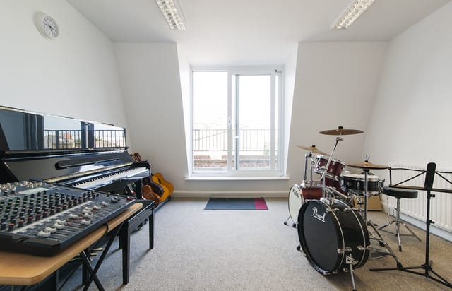 Large Music Room in artsHouse with piano, ideal for music workshops and team-building events.