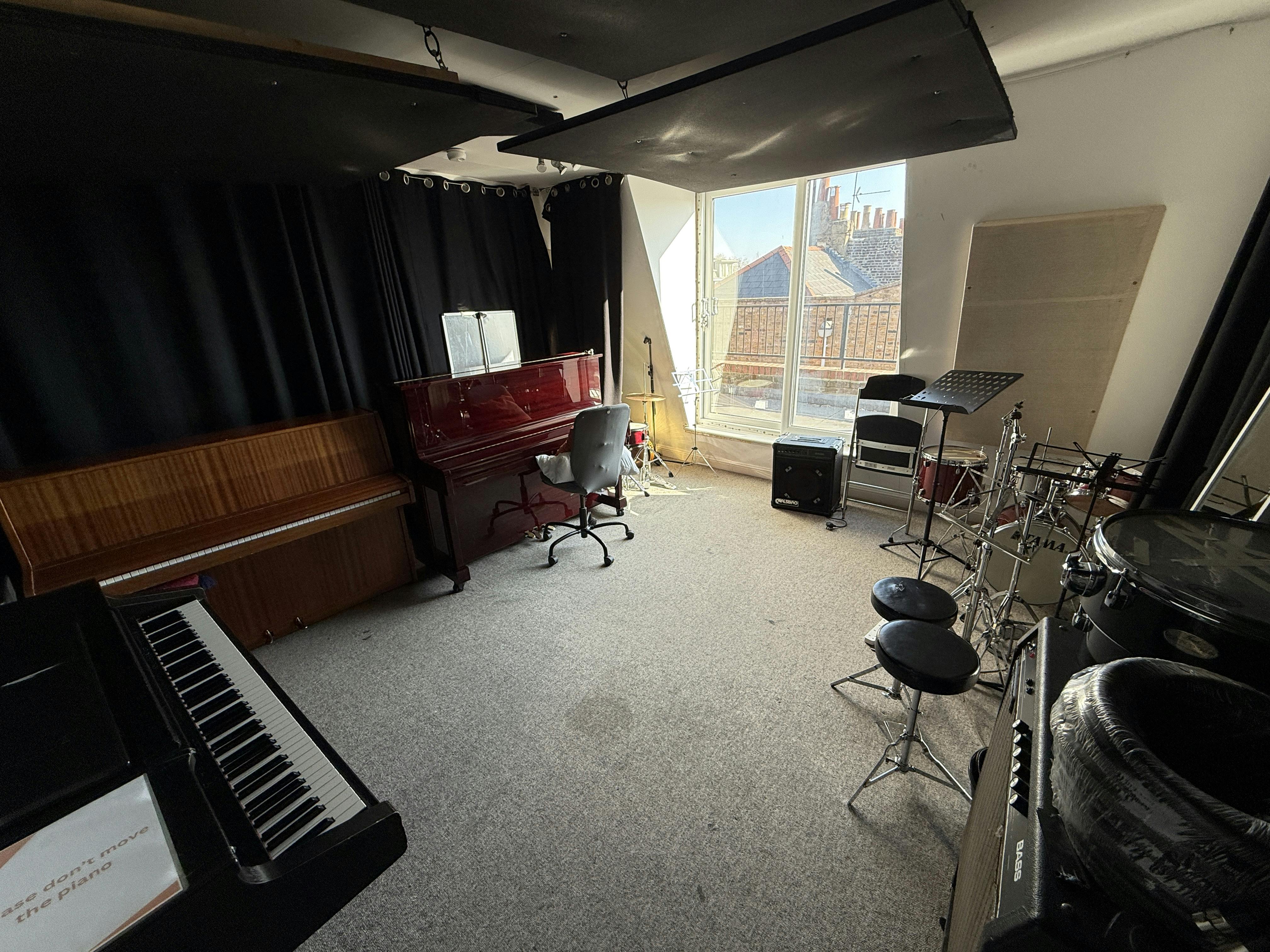 Large Music Room in artsHouse with piano, ideal for creative meetings and workshops.