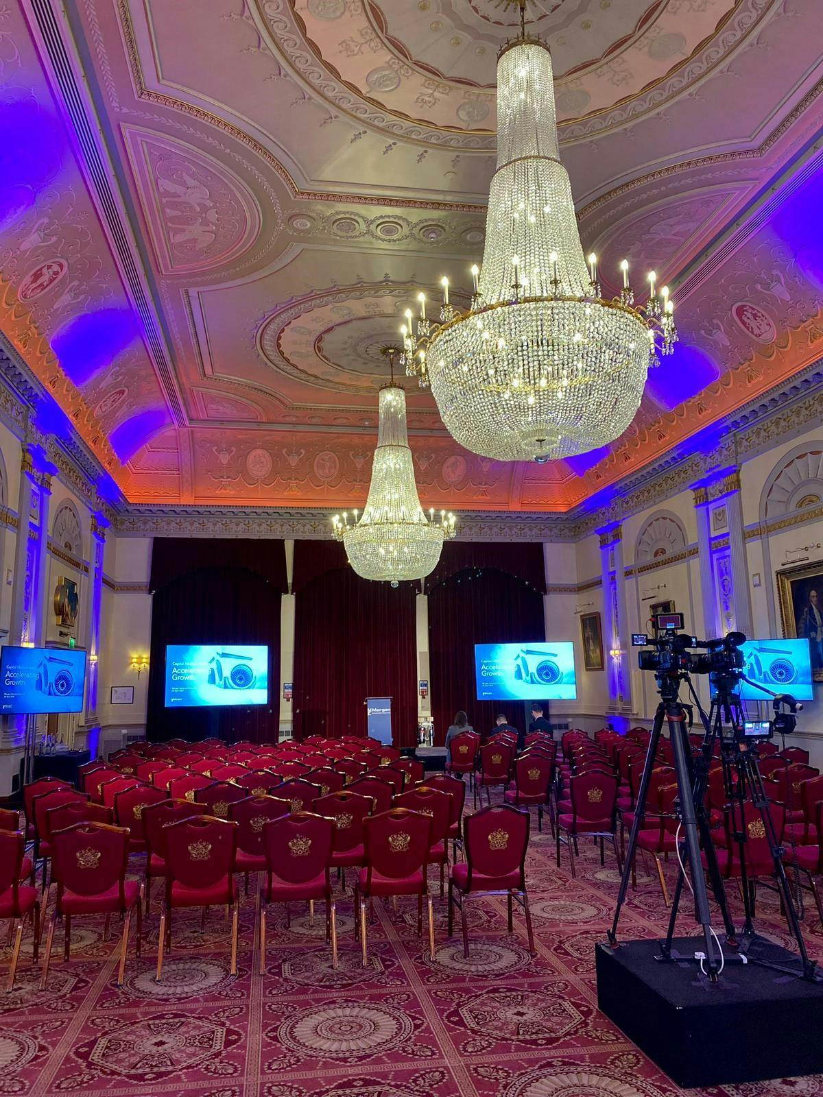 Great Hall at Plaisterers’ Hall, elegant chandeliers, conference event space.