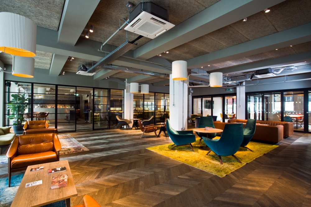 Modern meeting space with natural light for networking events and gatherings. - Banner