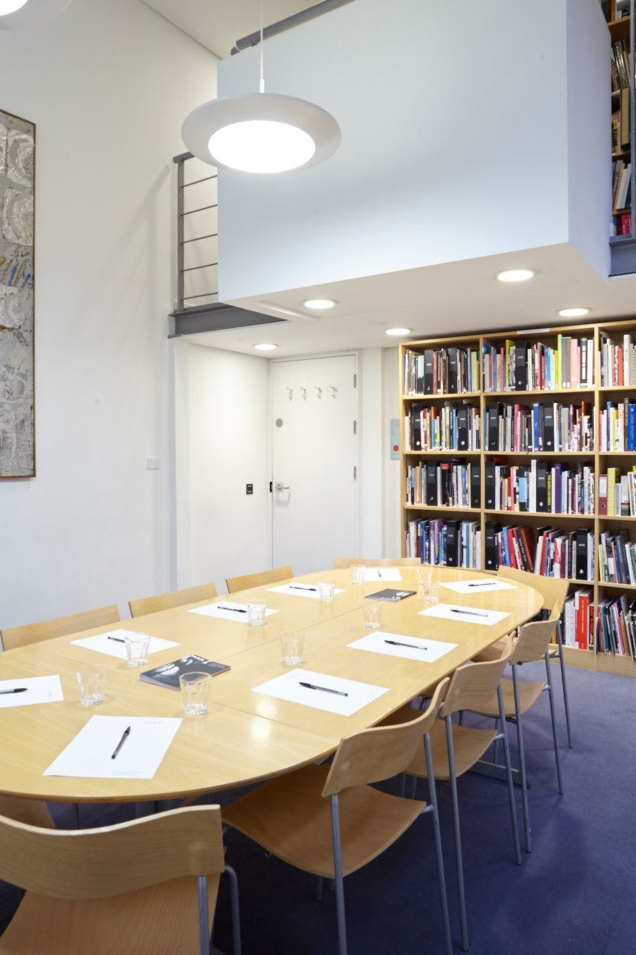 Meeting room in Ikon Gallery with wooden table, ideal for workshops and strategic meetings.