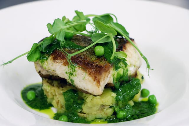 Elegant fish dish with creamy mashed potatoes for upscale dining events.
