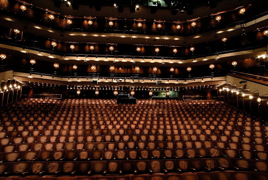 Barbican Theatre with tiered seating, perfect for conferences and concerts.