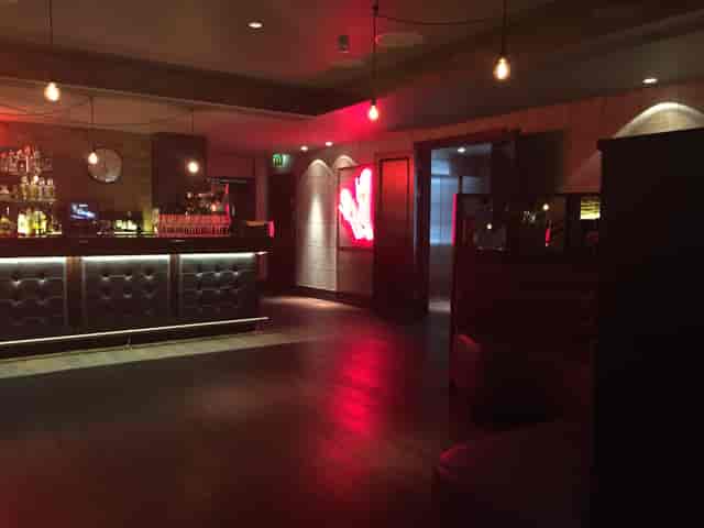 Sophisticated bar at Chez Mal, plush seating for corporate events and gatherings in London.