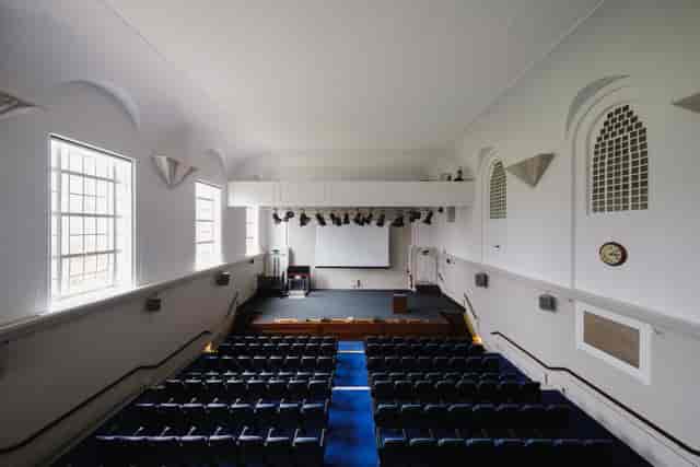 Tuke Hall auditorium with tiered seating, ideal for conferences and events.