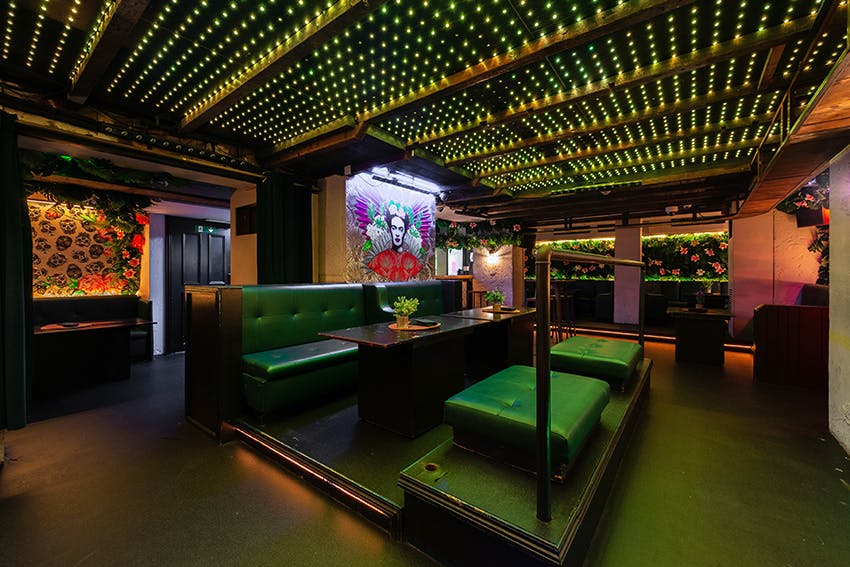 Vibrant Tonteria event space with modern seating, ideal for gatherings and celebrations.