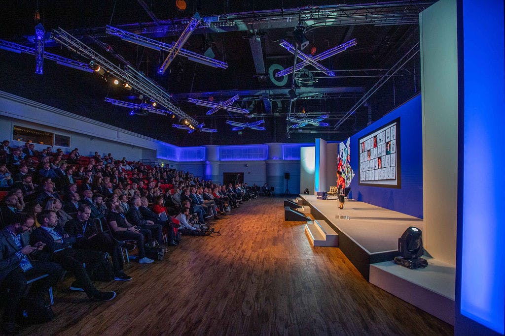 Live Room at Allianz Stadium, Twickenham: conference with speaker and audience engagement.