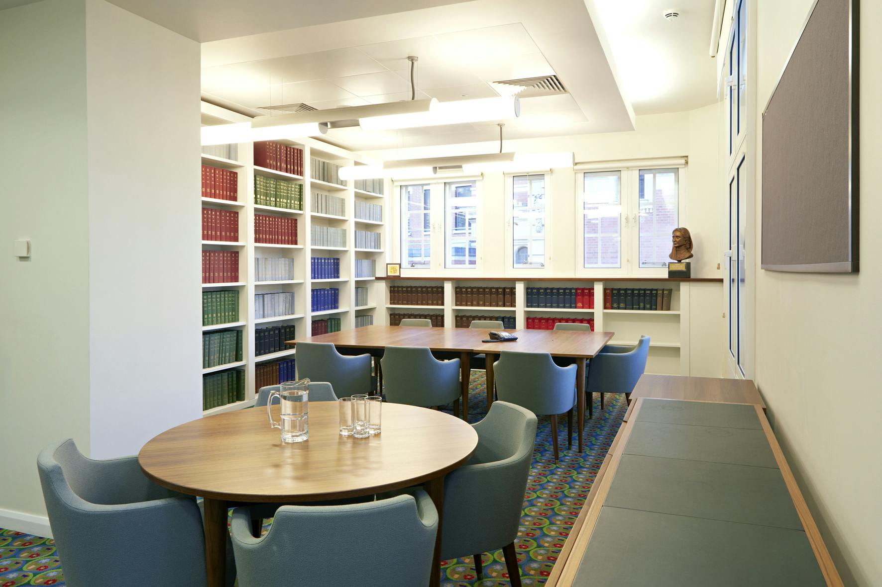 Meeting Room 6 at UK Supreme Court, featuring round tables for workshops and meetings.