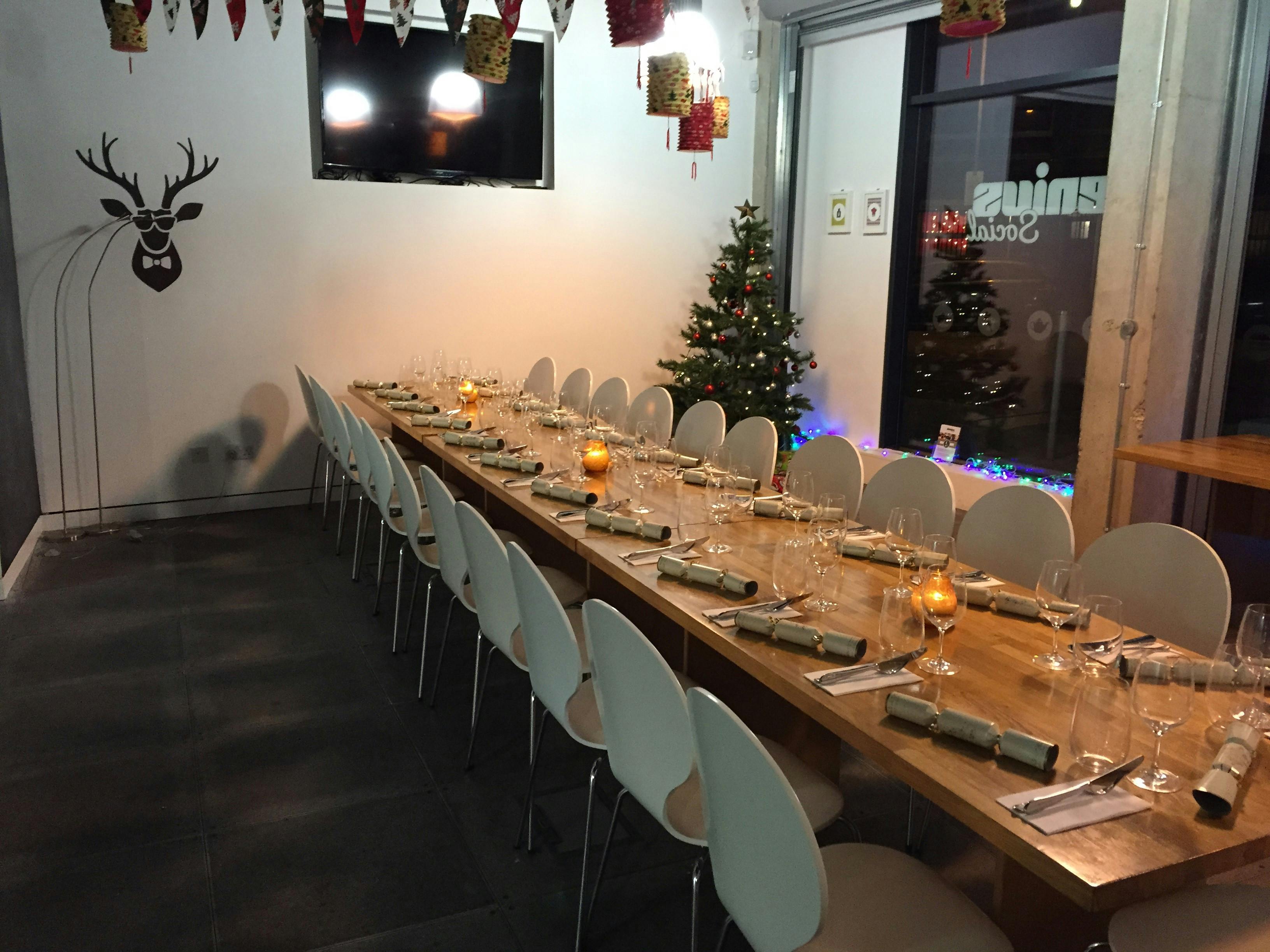 Cozy Christmas cooking event with elegant table settings and festive decor at Jenius Social.