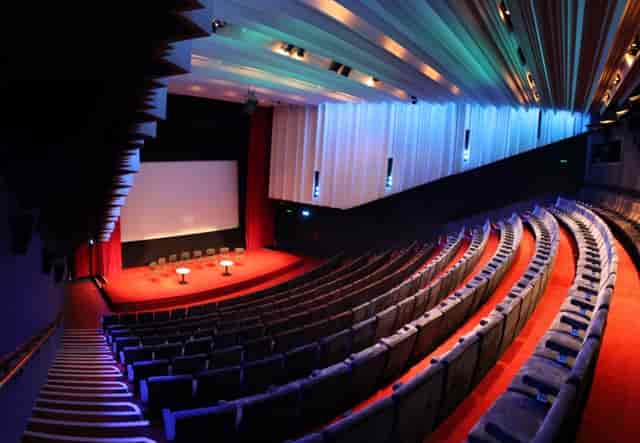 Cinema 1 at Barbican Centre: tiered seating auditorium for conferences and presentations.